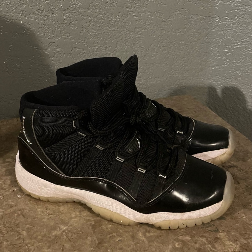 Men’s size 6.5 Jordan 11 Jubilee Black and White Sneakers